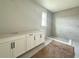 Modern bathroom featuring a double vanity and walk-in shower with gray tile at 2726 Ravencliffe Ter, Oviedo, FL 32765