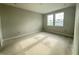 Unfinished bedroom with neutral walls, natural light from the three-panel window, and awaiting final touches at 2726 Ravencliffe Ter, Oviedo, FL 32765
