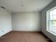 Bedroom with a large window offering natural light, and blank canvas walls at 2726 Ravencliffe Ter, Oviedo, FL 32765