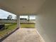 Covered patio with brick pavers overlooking the backyard, and providing an outdoor living space at 2726 Ravencliffe Ter, Oviedo, FL 32765
