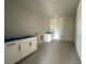 Spacious laundry room with white cabinets and utility connections, ready for appliances at 2726 Ravencliffe Ter, Oviedo, FL 32765