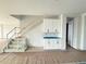 Open living area featuring a staircase and built-in cabinets, perfect for entertaining at 2726 Ravencliffe Ter, Oviedo, FL 32765