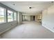 Spacious living room featuring bright windows and unfinished flooring, ready for customization at 2726 Ravencliffe Ter, Oviedo, FL 32765