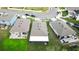 Three houses from above, highlighting backyard features like patios and screened enclosures at 3627 Crimson Clover Dr, Mount Dora, FL 32757