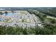 Large community view, showing numerous houses, streets, and a lake at 3627 Crimson Clover Dr, Mount Dora, FL 32757