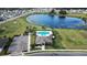 Community pool with a clubhouse, landscaping, and ample parking at 3627 Crimson Clover Dr, Mount Dora, FL 32757