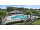 Relaxing community pool area with a covered pavilion and lounge chairs at 3627 Crimson Clover Dr, Mount Dora, FL 32757