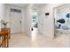 Bright and spacious entryway with tile flooring, leading to the living room and bathroom at 3627 Crimson Clover Dr, Mount Dora, FL 32757