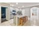 Modern kitchen with island, stainless steel appliances, and granite countertops at 3627 Crimson Clover Dr, Mount Dora, FL 32757