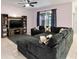 Open living room with sectional sofa and access to backyard at 3627 Crimson Clover Dr, Mount Dora, FL 32757