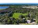 Aerial view of property showcasing large green area, farm house and red barn at 368 Belmond Dr, Debary, FL 32713