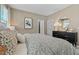 Bright bedroom with king-size bed, dresser and neutral color scheme at 368 Belmond Dr, Debary, FL 32713