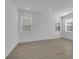 Spacious bedroom with light walls, wood floors, and multiple windows at 368 Belmond Dr, Debary, FL 32713