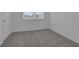Bright bedroom with grey carpet and neutral walls at 368 Belmond Dr, Debary, FL 32713