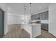 Modern kitchen with gray cabinets, white counters, and island at 368 Belmond Dr, Debary, FL 32713