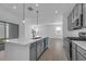 Open concept kitchen with island and stainless steel appliances at 368 Belmond Dr, Debary, FL 32713