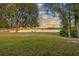 Lakefront property with grassy area and seating at 3819 Dallas Blvd, Orlando, FL 32833