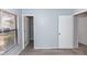 Bright bedroom with a large window, wood-look flooring, and a view of the outdoors at 512 Holbrook Cir, Lake Mary, FL 32746