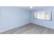 A cozy bedroom with a ceiling fan, window with blinds, and wood-look flooring at 512 Holbrook Cir, Lake Mary, FL 32746