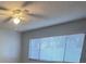 Bright bedroom with ceiling fan and window blinds at 512 Holbrook Cir, Lake Mary, FL 32746