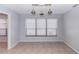Bright dining room with tile floor, light fixture and large window at 512 Holbrook Cir, Lake Mary, FL 32746