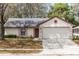 Charming single-story home with a two-car garage and stone accents at 512 Holbrook Cir, Lake Mary, FL 32746