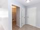 Bright foyer showcasing a white front door and access to laundry room at 512 Holbrook Cir, Lake Mary, FL 32746