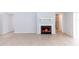 Cozy living room featuring a fireplace, tile flooring and large windows at 512 Holbrook Cir, Lake Mary, FL 32746