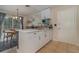 White kitchen with stainless steel appliances and breakfast bar at 5158 Twine St, Orlando, FL 32821