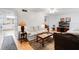 Living room with light-colored sofas and a view of kitchen at 5824 La Costa Dr, Orlando, FL 32807