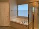 Bathroom with soaking tub and shower at 6344 Earthgold Dr, Windermere, FL 34786