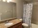 Clean bathroom with granite countertop and shower at 6344 Earthgold Dr, Windermere, FL 34786