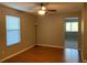 Spacious bedroom with wood flooring and floor lamp at 6344 Earthgold Dr, Windermere, FL 34786