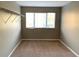 Simple bedroom with carpet and large window at 6344 Earthgold Dr, Windermere, FL 34786