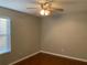 Bright bedroom with wood flooring and ceiling fan at 6344 Earthgold Dr, Windermere, FL 34786