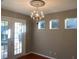 Bright dining room features a chandelier and French doors at 6344 Earthgold Dr, Windermere, FL 34786