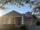 Attractive Craftsman style home with two-car garage at 6344 Earthgold Dr, Windermere, FL 34786