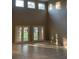 Sunlit Gathering room with high ceilings and backyard access at 6344 Earthgold Dr, Windermere, FL 34786