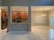 Open kitchen with stainless steel appliances and light wood cabinets at 6344 Earthgold Dr, Windermere, FL 34786