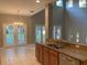 Kitchen with granite counters, wood cabinets, and breakfast nook at 6344 Earthgold Dr, Windermere, FL 34786
