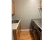 Laundry room with cabinets and modern washer/dryer at 6344 Earthgold Dr, Windermere, FL 34786