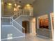Two-story foyer with elegant staircase and high ceilings at 6344 Earthgold Dr, Windermere, FL 34786