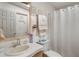 Bathroom with a toilet, sink, and shower/tub combo at 6375 Lolly Bay Ne Loop, Winter Haven, FL 33881