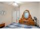 Bedroom with a double bed and a large antique dresser at 6375 Lolly Bay Ne Loop, Winter Haven, FL 33881
