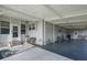 Covered carport with storage and seating area at 6375 Lolly Bay Ne Loop, Winter Haven, FL 33881