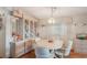 Bright dining room featuring a round table with four chairs and built-in hutch at 6375 Lolly Bay Ne Loop, Winter Haven, FL 33881