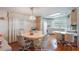 Charming dining area with a round table and four chairs, adjacent to kitchen at 6375 Lolly Bay Ne Loop, Winter Haven, FL 33881