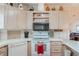 Well-equipped kitchen featuring white appliances and wood cabinets at 6375 Lolly Bay Ne Loop, Winter Haven, FL 33881