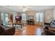 Spacious living room with laminate floors and fireplace at 6375 Lolly Bay Ne Loop, Winter Haven, FL 33881
