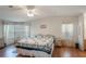 Spacious main bedroom with a ceiling fan and bay window at 6375 Lolly Bay Ne Loop, Winter Haven, FL 33881